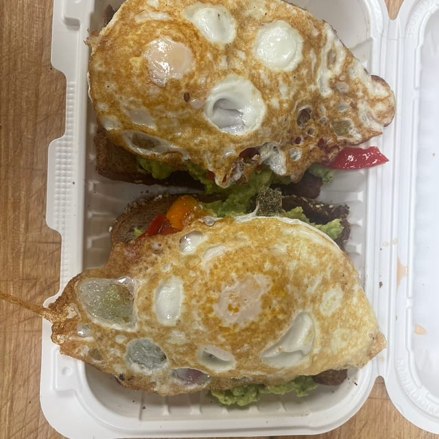 Avocado Wheat Toast With Poached Eggs.
