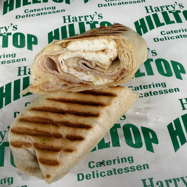 Turkey, Alpine Lace Swiss, Avocado, Honey Mustard on a Wrap.