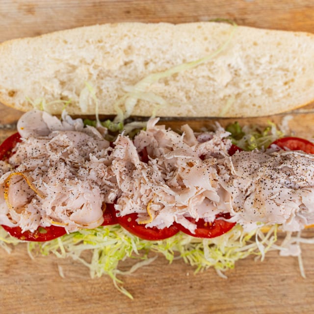 Turkey Club on a Hero with Mayo.